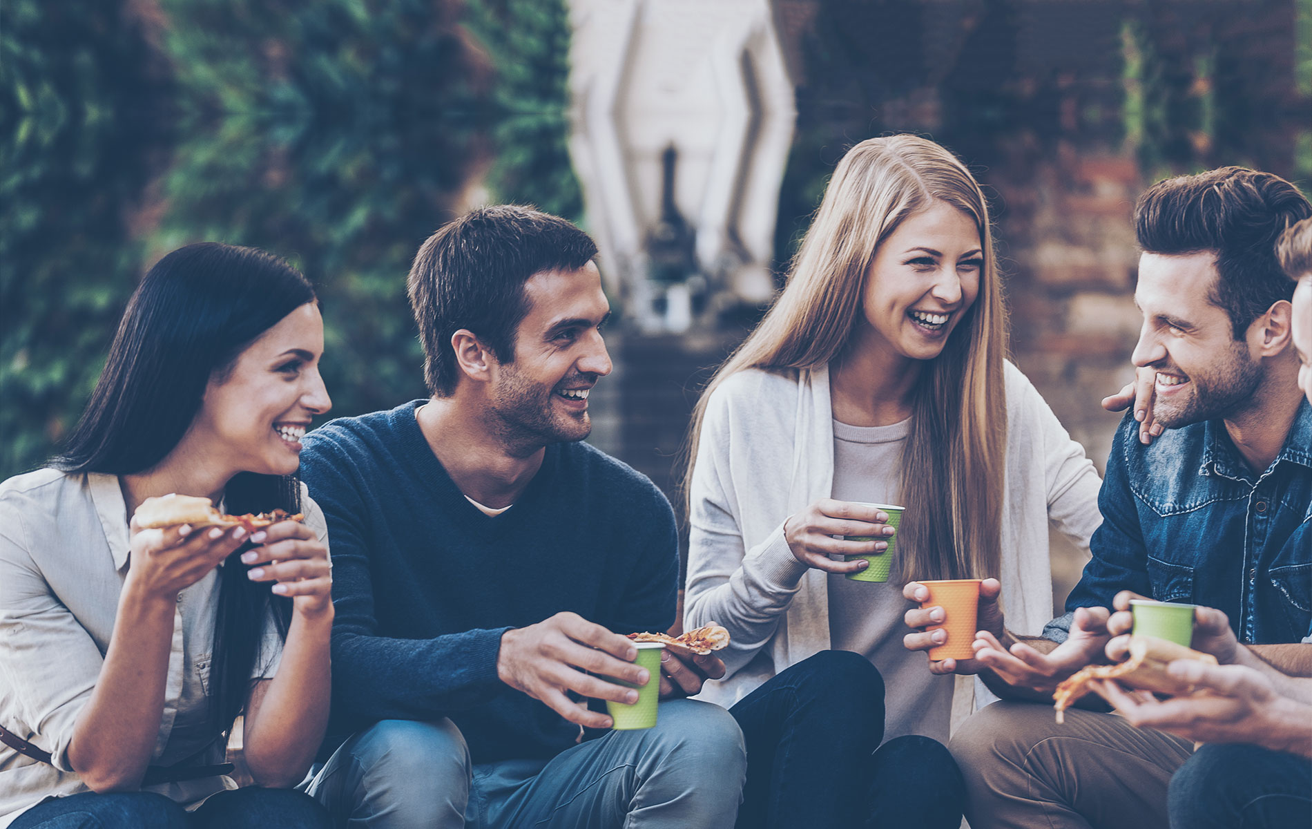 Group of friends enjoying drinks outdoors